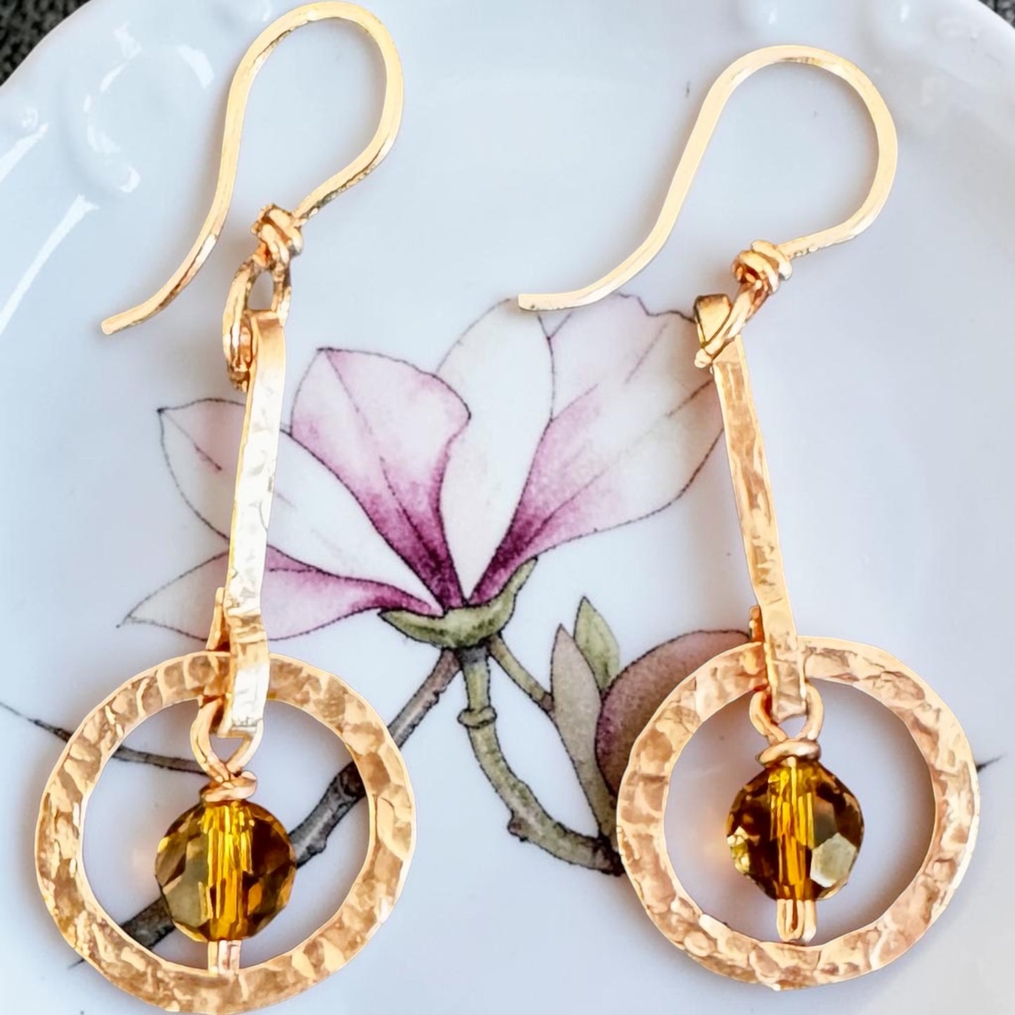 Copper-Art Deco-inspired earrings with a faceted amber crystal bead