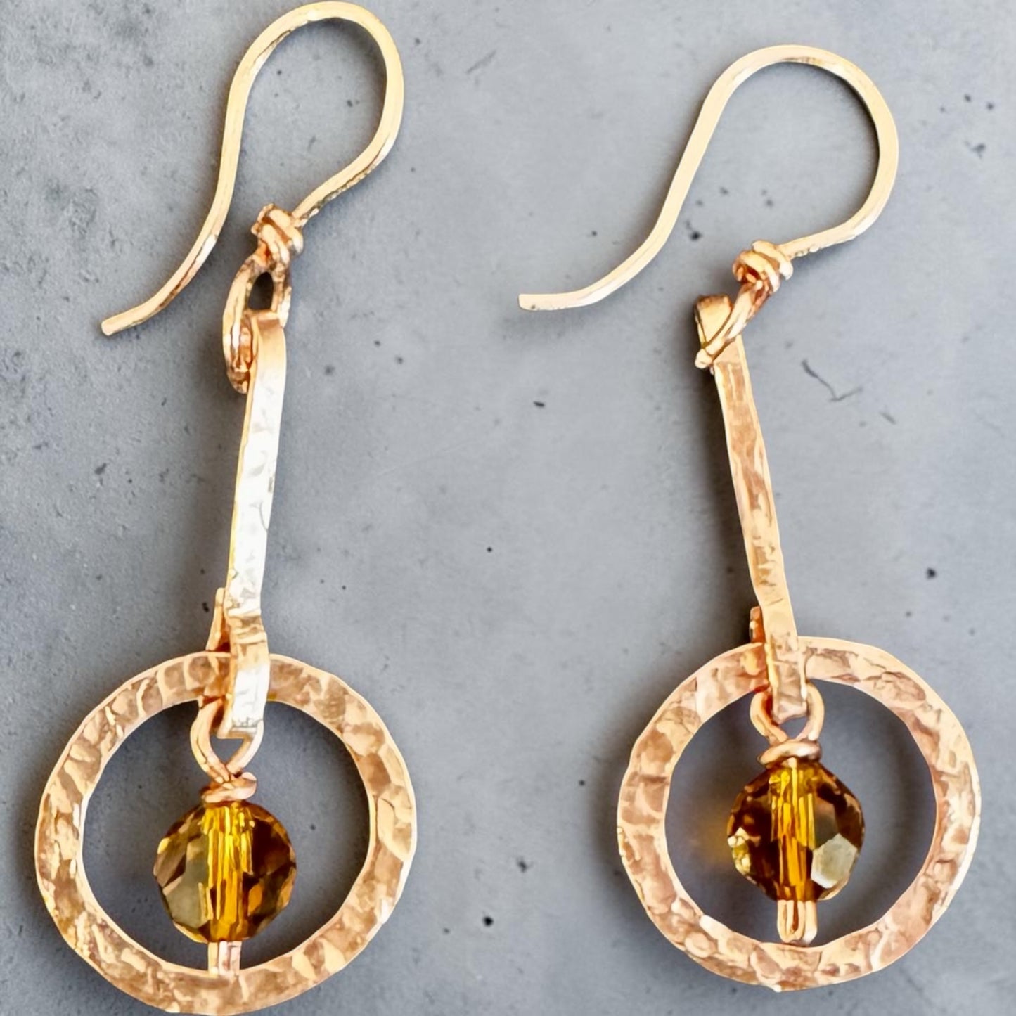 Copper-Art Deco-inspired earrings with a faceted amber crystal bead